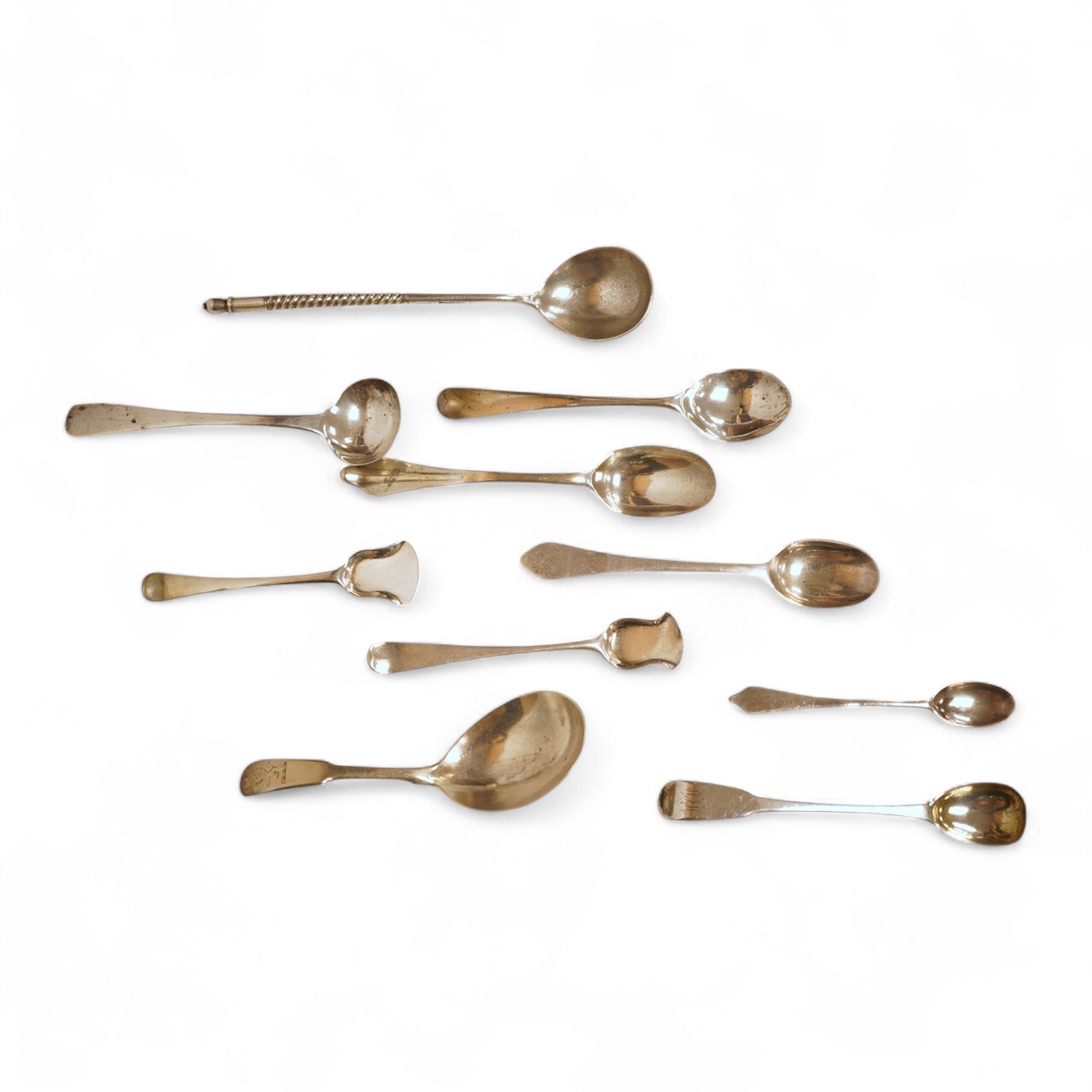 A small collection of nine assorted Georgian and later small silver or white metal spoons, including mustard ladles and other condiment spoons, a caddy spoon, London, 1799, together with a 19th century Russian 84 zolotni